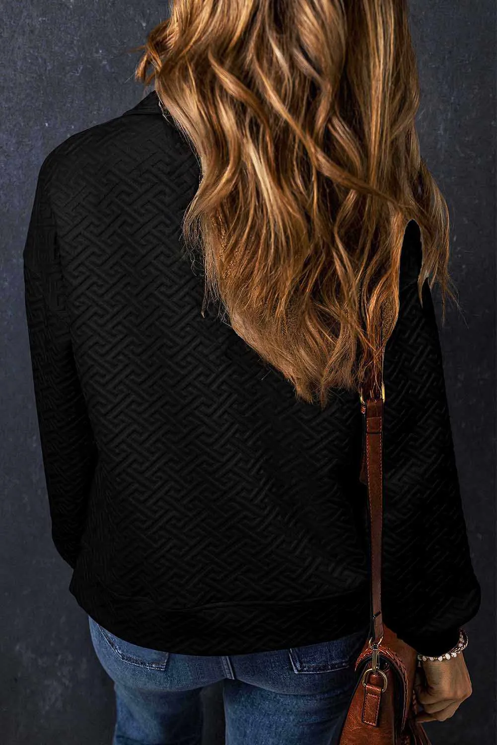 Textured black half-zip sweatshirt