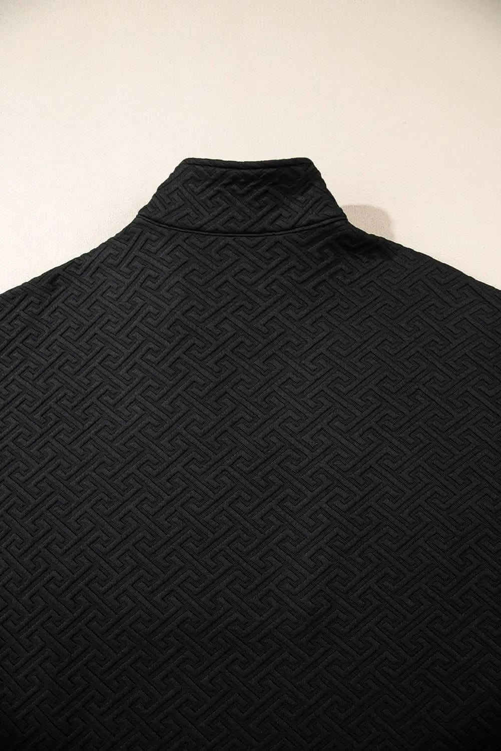 Textured black half-zip sweatshirt