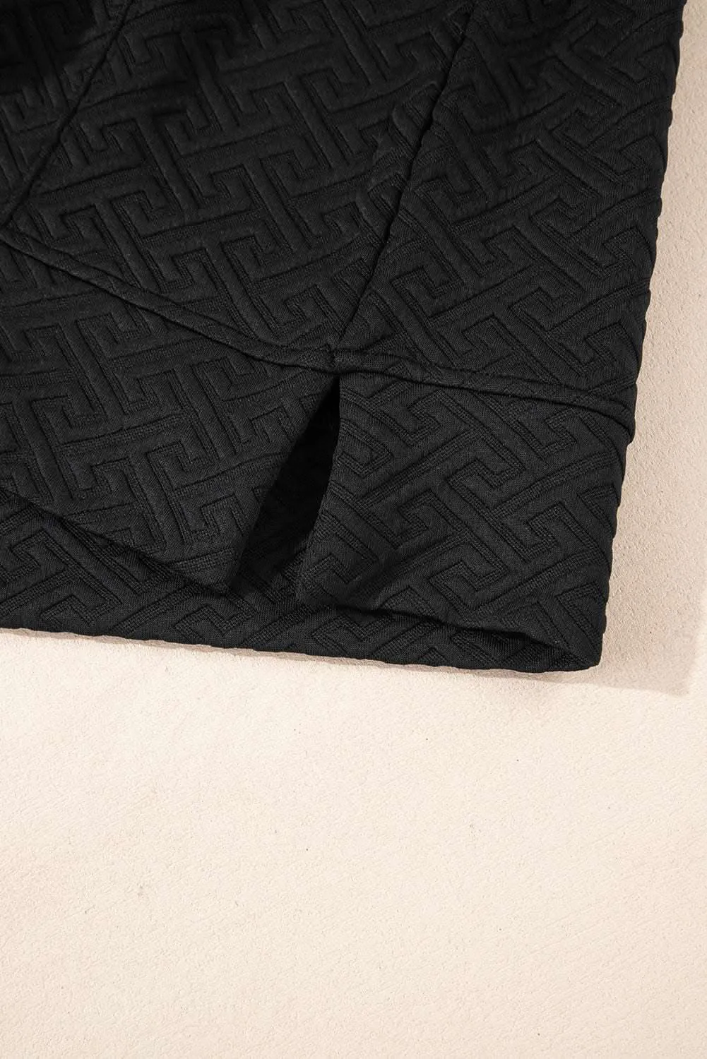 Textured black half-zip sweatshirt