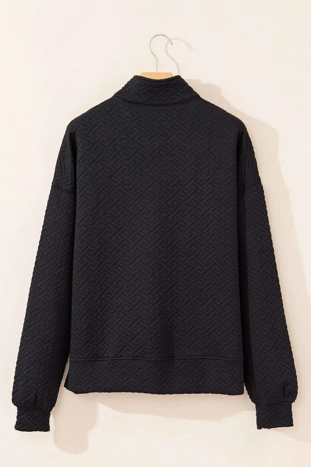 Textured black half-zip sweatshirt